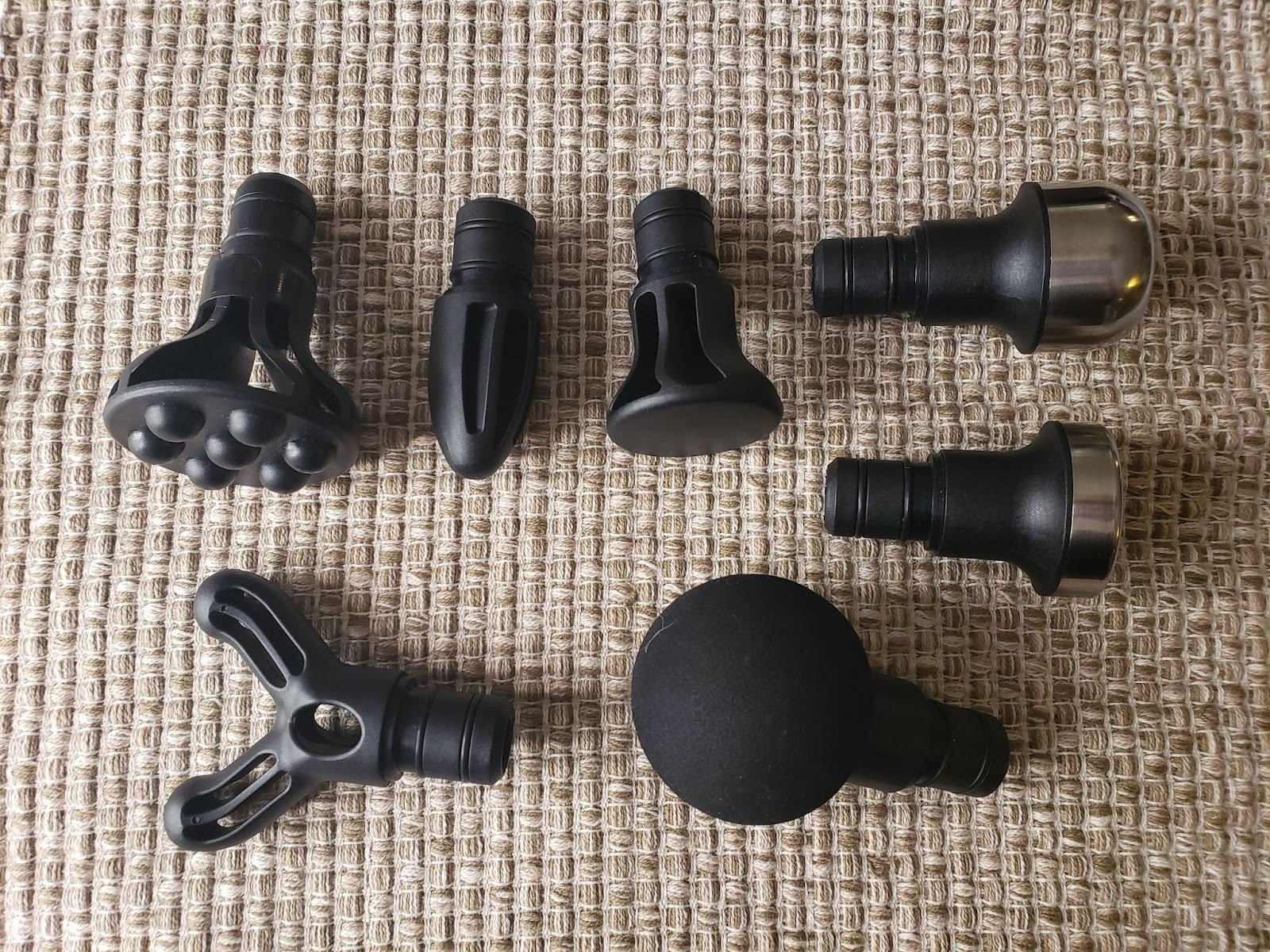 seven attachment heads of varying shapes