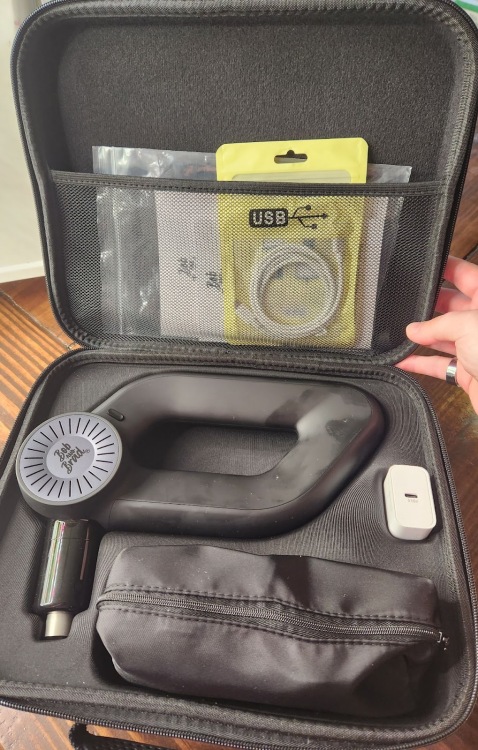 open case displaying massage gun inside