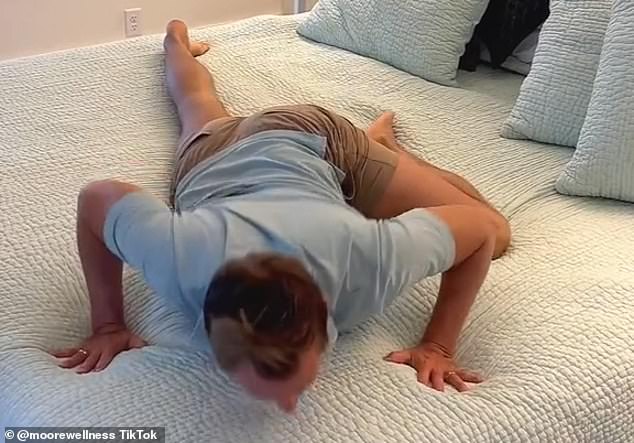 James Moore, from Kentucky in the US, demonstrated the 'thread the needle' stretch on a TikTok video viewed by nearly 13million people. Lying flat on his front, Mr Moore raises his left leg, so it is at a 90-degree angle with his right and the knee is bent
