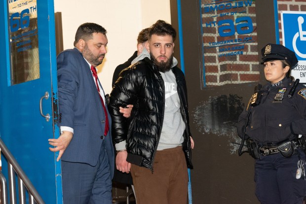 Mohammed Izzeddin, 22, is walked from the NYPD 66th Precinct station house in Brooklyn New York City on Thursday, Dec. 28, 2023 after being charged in the Dec. 23 rape of a 49-year-old woman. (Gardiner Anderson for New York Daily News)