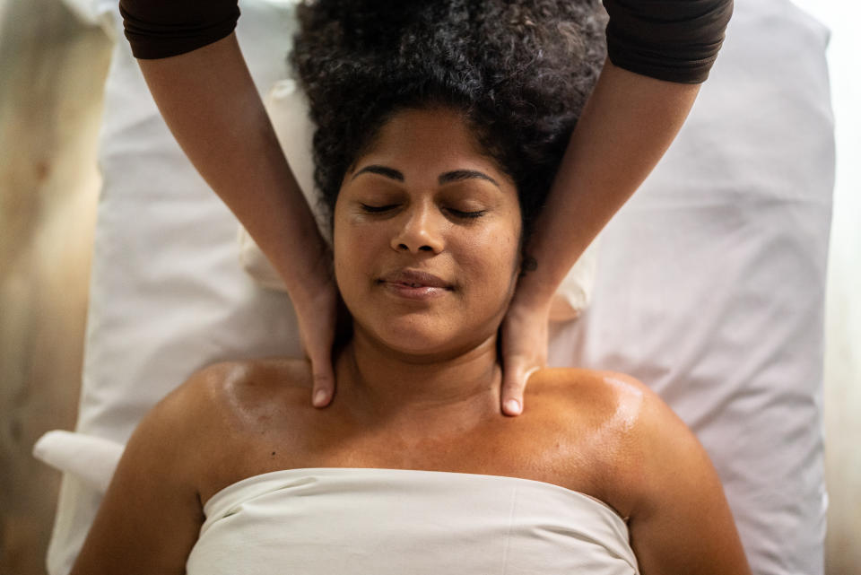 person receiving a massage at a spa