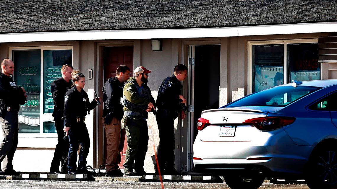 Kennewick police help federal agents search a massage business at 6201 West Clearwater Ave. Wednesday morning in Kennewick. The effort was part of a larger series of searches across Washington state focused on human trafficking, said Kennewick Sgt. Chris Littrell.