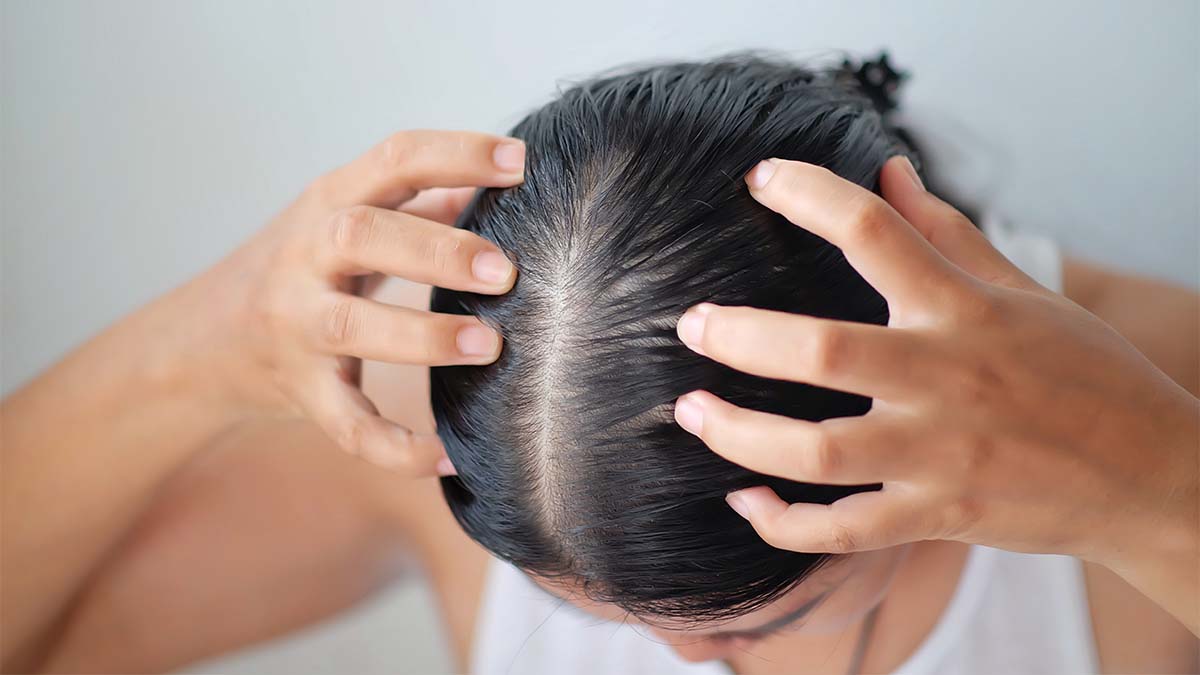 Woman-massaging-her-scalp.jpg